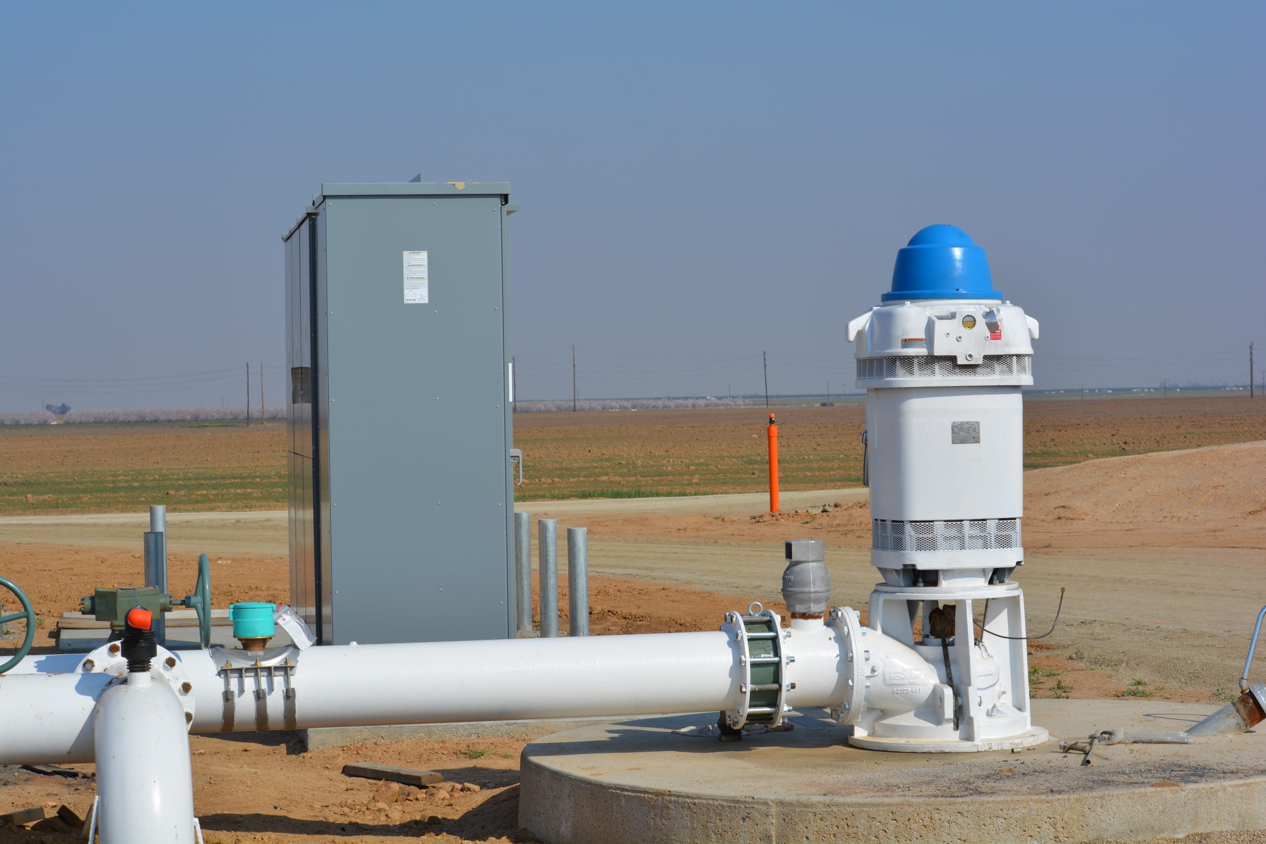 Farm Pump & Irrigation electric turbine pump motor and control panel installed at a Central Valley farm field
